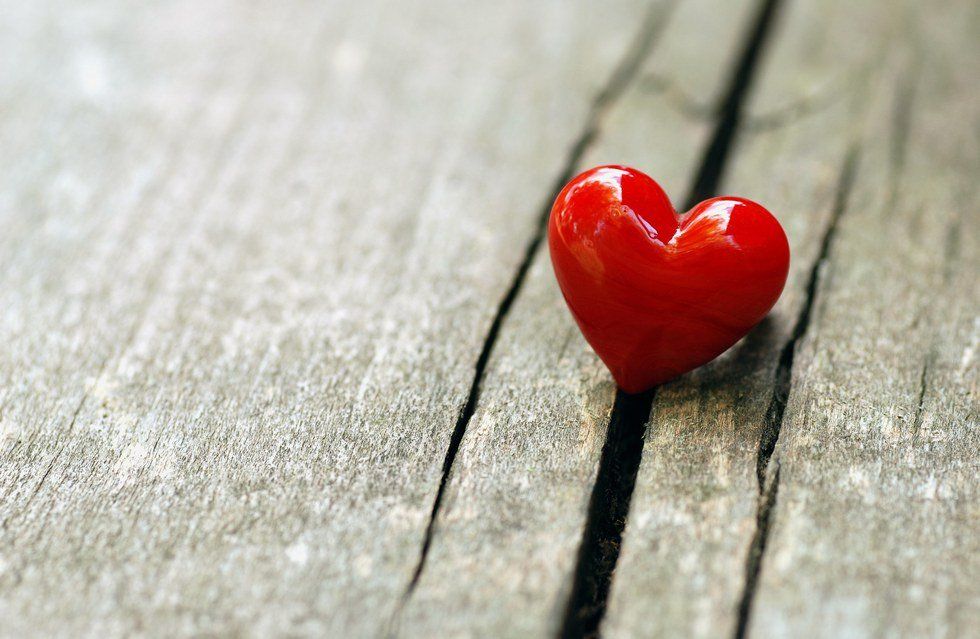 ​a heart shaped item on a wooden panel