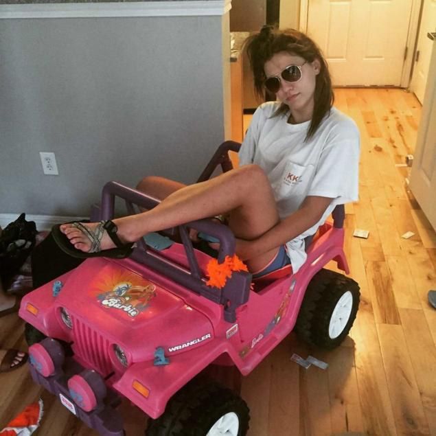 Little girl driving barbie car online