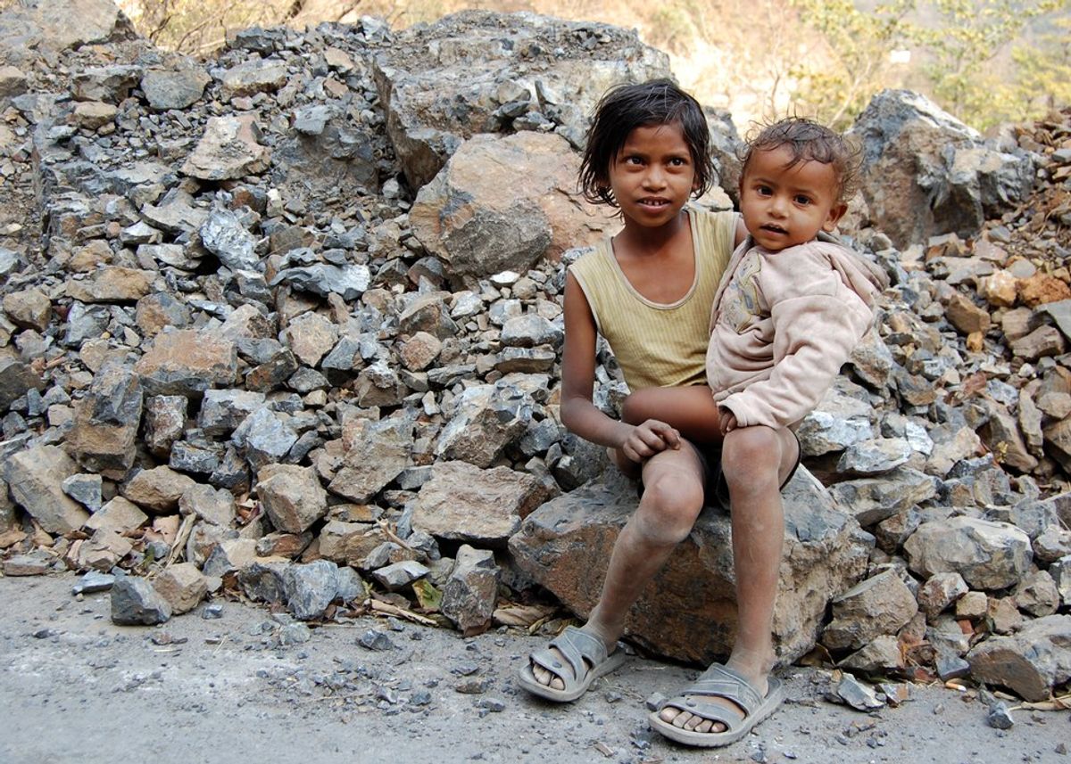 The Little Beggar Girl On The Side of the Road