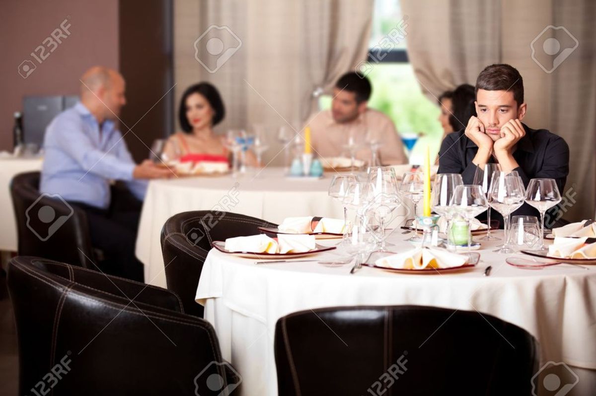 Man Sits In Isolated Anguish As Rest Of Party Heads For Salad Bar
