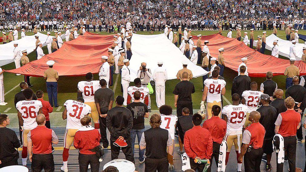 Athletes Incite Outrage By Kneeling For National Anthem