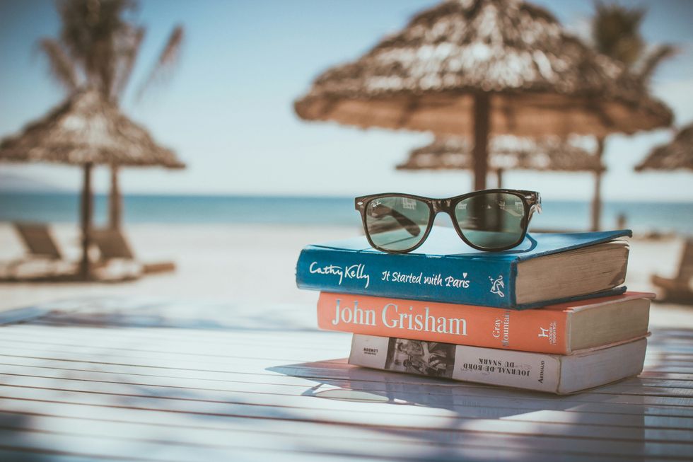 pair of sunglasses on a stack on books