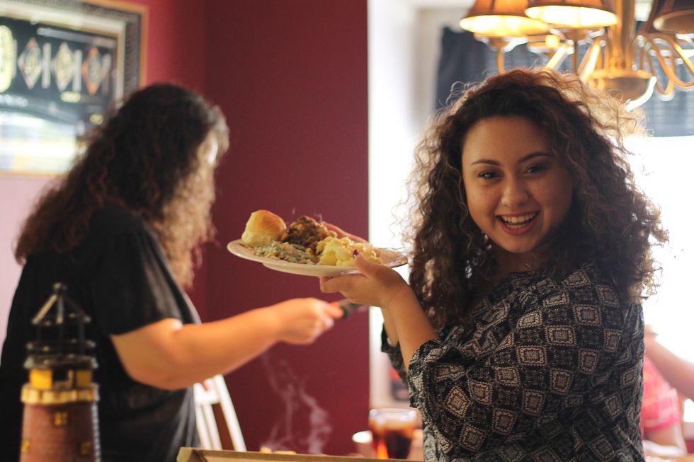 Woman holding a plate of food